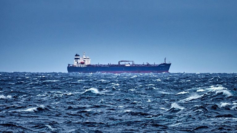 Ship delivering cargo in the stormy Mediterranean sea