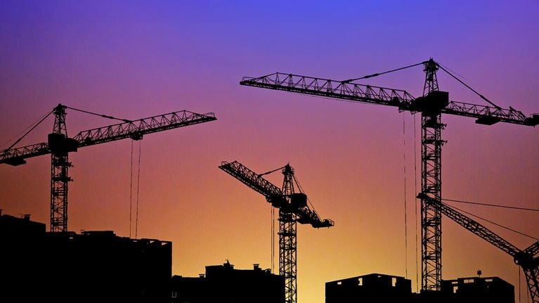 Silhouette of construction site crane