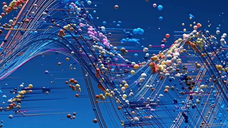 Abstract streams of colorful lines and small spheres flow in wave-like patterns across a blue background