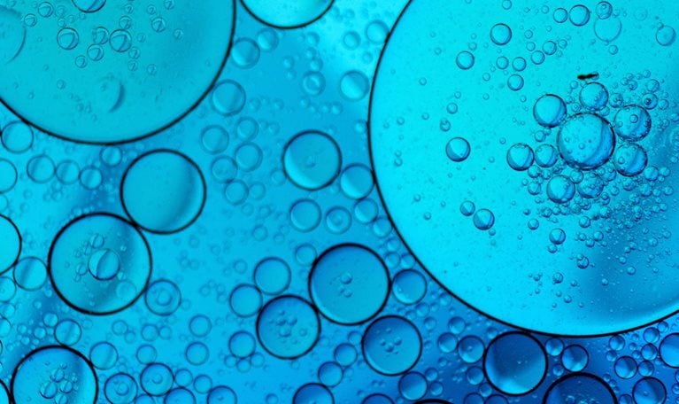 Blue abstract background with oil and water - stock photo