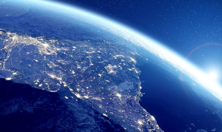 Image of India at night viewed from space with city lights illuminating the country.