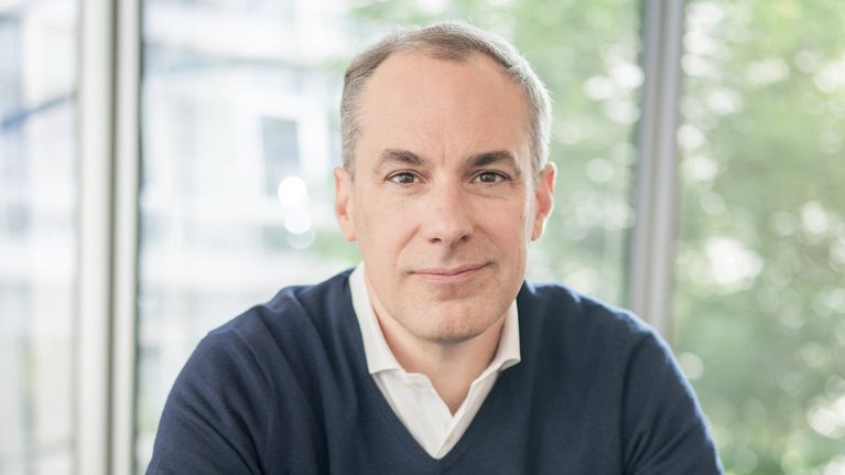 Smiling portrait image of Cedrik Neike