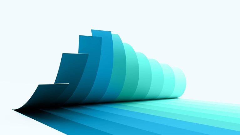 A series of overlapping, curved paper like sheets arranged in a cascading formation, transitioning in color from deep teal to light aqua. The shapes create a smooth gradient effect and cast elongated, layered shadows across a light gray background.