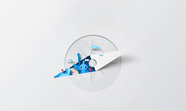 A white sheet of paper has been cut and folded, creating the silhouette of a compass. Inside of the compass needle are vibrant blue and red color shapes depicting various aspects of leadership and it’s innovative and collaborative nature with symbols of communication and ideas.