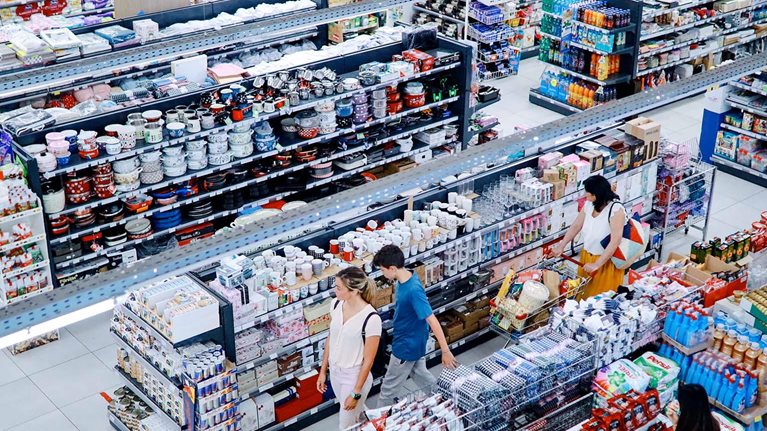 Overhead image of people buying in the large supermarket