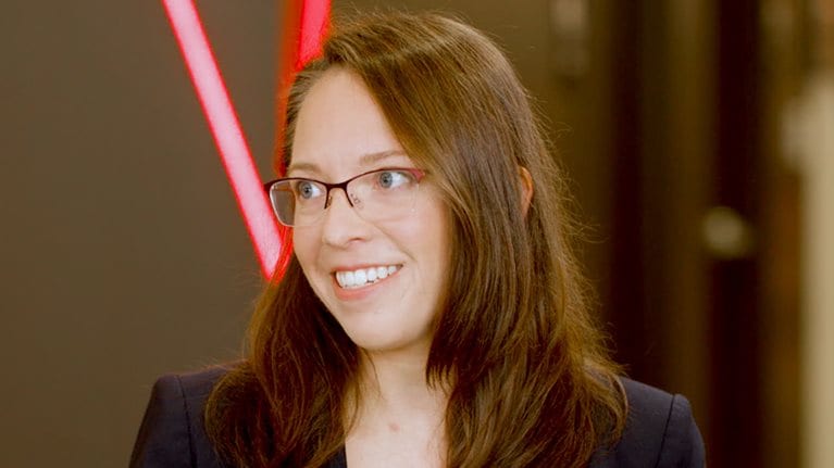 A still image of Ashley Fenn being interviewed.