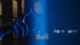 Close up view of woman hand using interactive touchscreen display of electronic kiosk