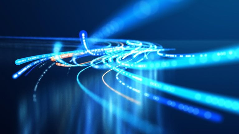 This image is a conceptual representation of fiber optic cables conveying high-speed data. It illustrates the concept of rapid data transmission through network infrastructures.