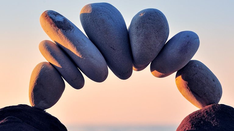 An arc of pebbles along the coast