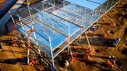 Aerial drone view of an electric vehicle battery factory that is under construction