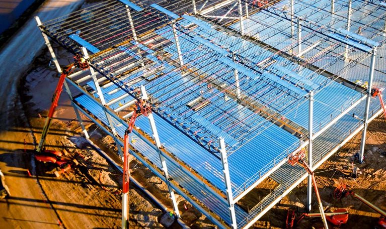 Aerial drone view of an electric vehicle battery factory that is under construction